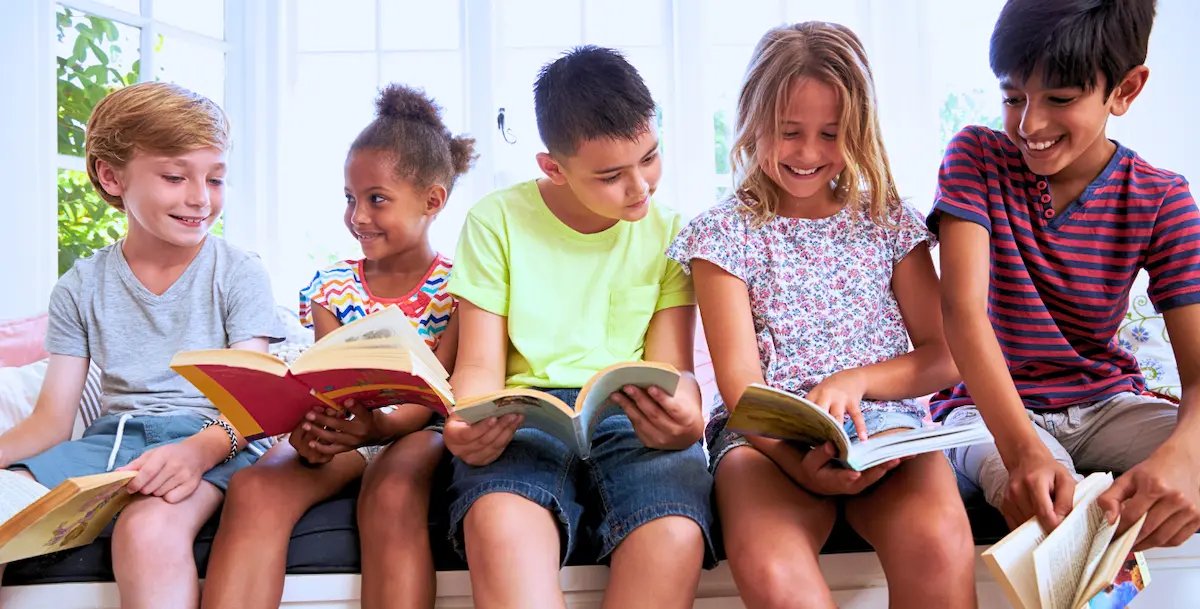Five multiethnic Pre K 5 students sharing personalized literacy learning Key Elements to Literacy Learning Kids Read Now 1