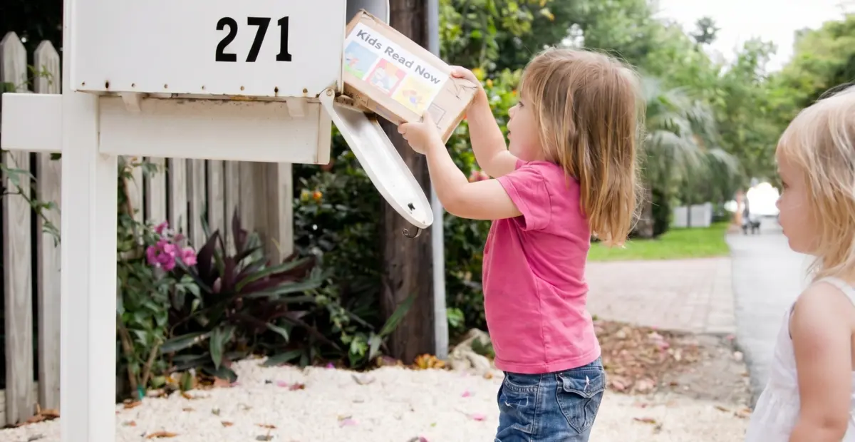 Kids Getting Book Delivery at Mailbox