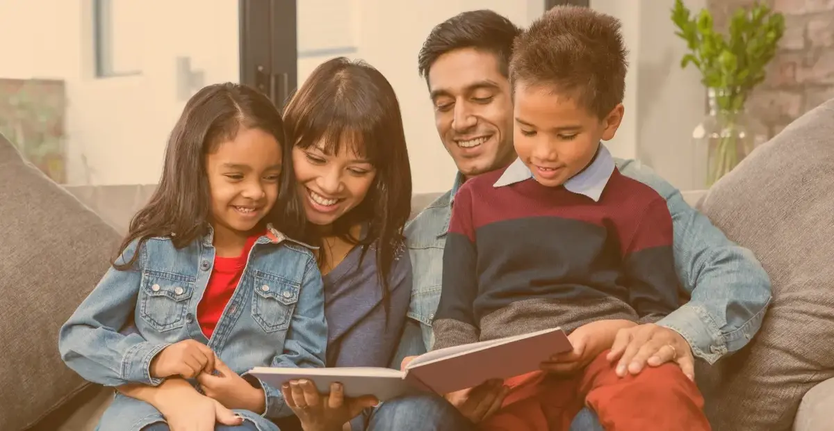 Latino Hispanic family reading bilingual books Kids Read Now is supporting bilingual literacy