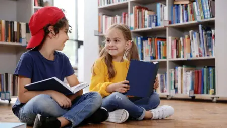 Bigstock Cute Little Children Reading B 327859711