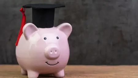 Bigstock Smiling Pink Piggy Bank Wearin 319058059