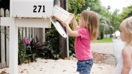 Kids Getting Book Delivery at Mailbox