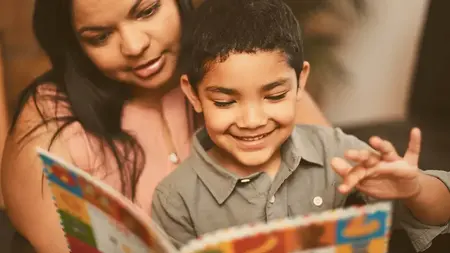 Latino Hispanic mother and child reading bilingual books Kids Read Now is supporting bilingual literacy
