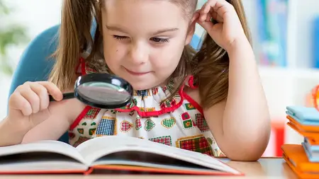 Magnifying glass girl with book