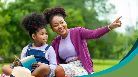 Young girl reading with adult caregiver support Kids Read Now