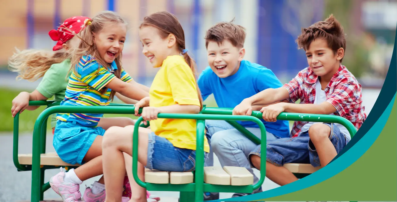 PreK-5 students on merry-go-round - motivation and engagement - Kids Read Now