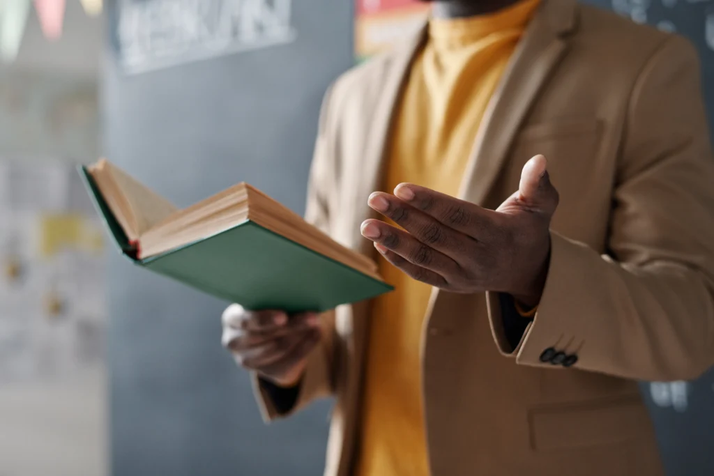 Teacher reading a chapter book - Novel Read-Alouds for Older Students Kids Read Now