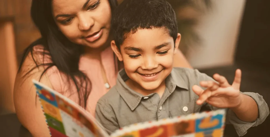 Latino/Hispanic mother and child reading bilingual books - Kids Read now is supporting bilingual literacy